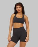 Alex is 5’5” and wears a size XS.